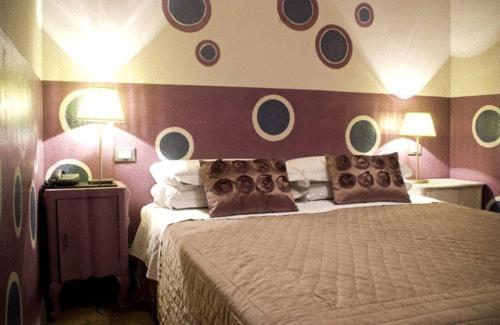 Postel nebo postele na pokoji v ubytování Hotel Colombo Genova