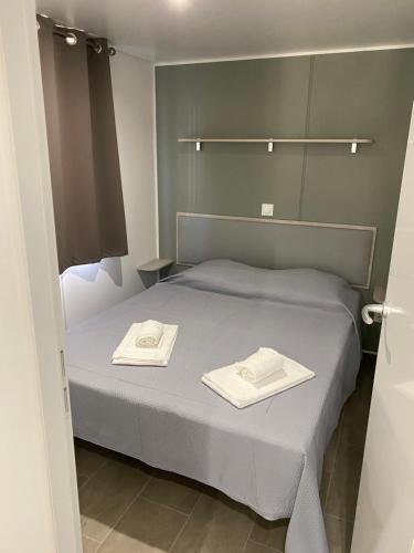 Katil atau katil-katil dalam bilik di Palombaggia location i pini Porto Vecchio