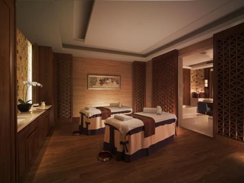 Ένα ή περισσότερα κρεβάτια σε δωμάτιο στο Shangri-La Guilin
