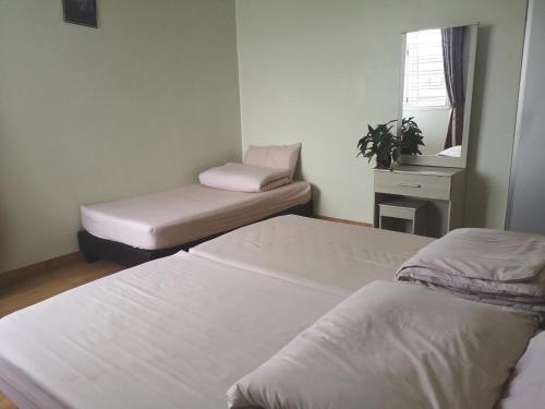 Letto o letti in una camera di Tangkak Greenville Homestay