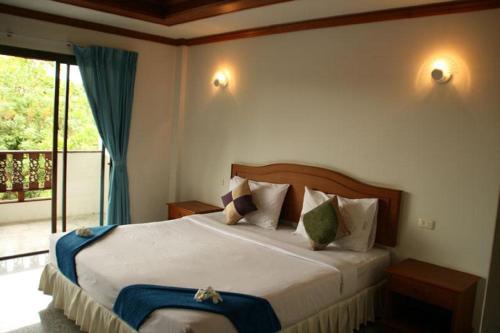 Кровать или кровати в номере Marina Beach Resort - SHA Extra Plus