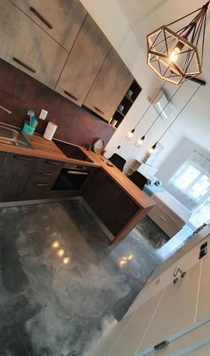 an overhead view of a kitchen with a wooden table at Slow motion in Kaštela