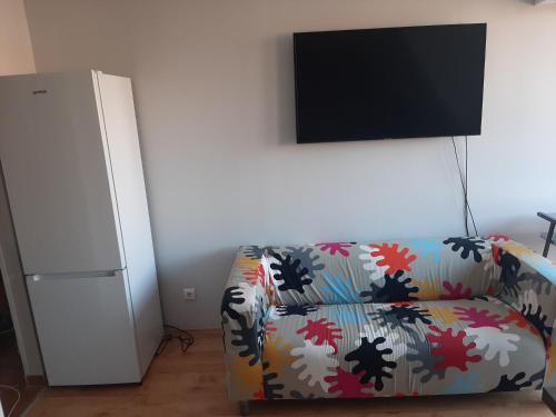 Televizorius ir (arba) pramogų centras apgyvendinimo įstaigoje Elit Apartman