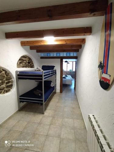 a room with bunk beds in a house at Cal Jardiner in Rialp