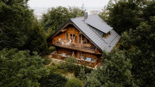 a wooden house in the middle of a forest at Naturtraum Georgshöhe in Thale
