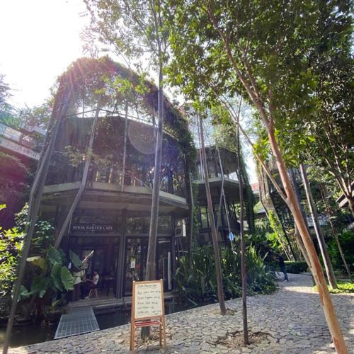 a building with a sign in front of it at 9am-5pm, SAME DAY CHECK IN AND CHECK OUT, Work from Home, Comfy & Quiet Tamarind Suites-Cyberjaya by Flexihome-MY, in Cyberjaya