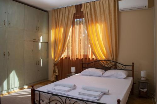 a bedroom with a bed with towels on it at Midtown Place Apartment DORIS 1 with garage in Plovdiv