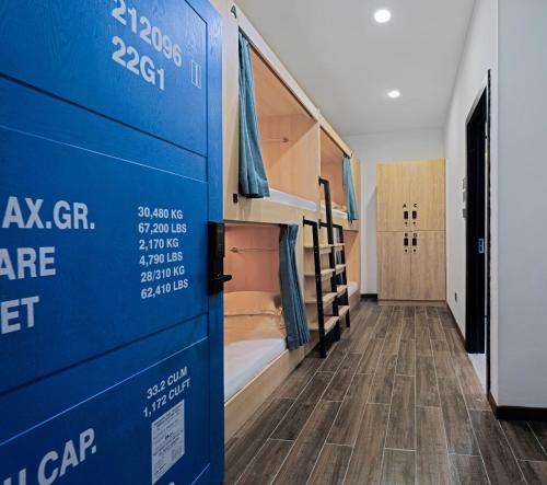 a room with a bunk bed and a hallway at Zou Qu Ye Travel Hotel in Chongqing
