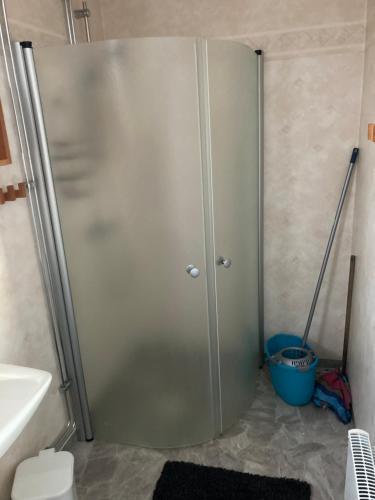 a shower stall in a bathroom next to a sink at Bärvallen 388 in Sälen