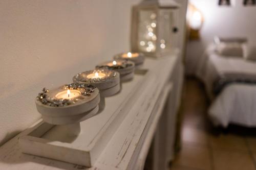 a group of candles on a table in a room at B&B Alexander in Pollutri