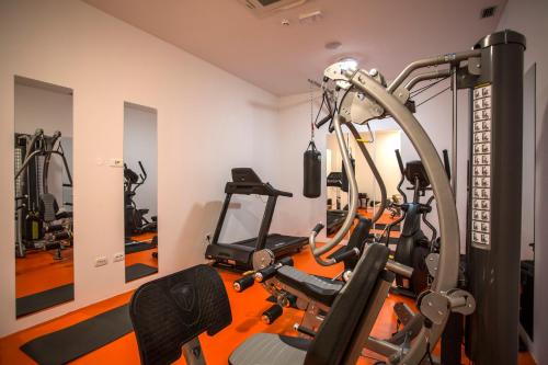 a room with a gym with a treadmill at Hotel Manora in Nerezine