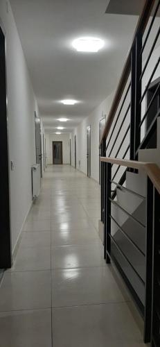 an empty hallway in a building with a staircase at Konopka Forest Home & SPA in Bukovel