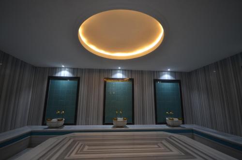 a room with a large orb hanging from the ceiling at Snowflake Dag Hotel & SPA in Sarıkamıs
