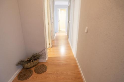 a hallway with two baskets on the floor of a room at Apartamento Rural New Folch in Morella