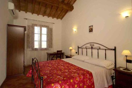 Postel nebo postele na pokoji v ubytování il Chiassetto Agriturismo No Kids