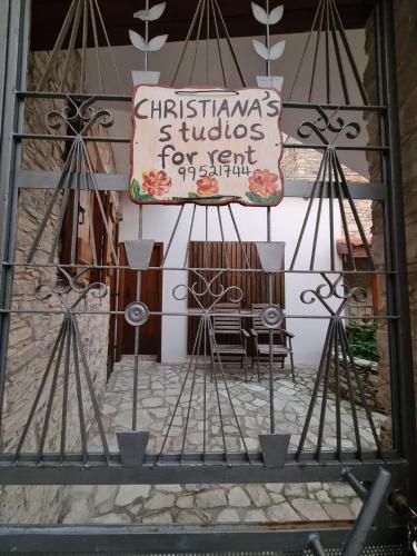 a sign on the side of a building at Christiana's stone studios in Pano Lefkara