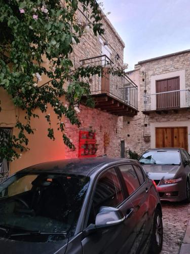 a black car parked in front of a building at Christiana's stone studios in Pano Lefkara