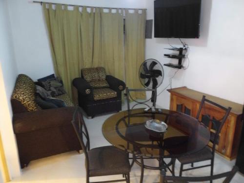 a living room with a couch and a table at Jamaica Vacation Montego Bay Guesthouse Cottage villa in Montego Bay