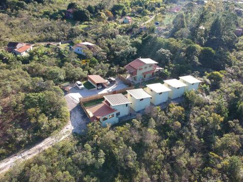 an aerial view of a house in the forest at Green Chales - Vale do Capão in Vale do Capao