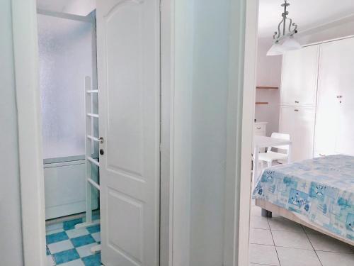 a room with a door leading to a bedroom at Stars Home in Tropea
