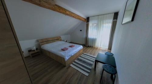 Ένα ή περισσότερα κρεβάτια σε δωμάτιο στο Eva House