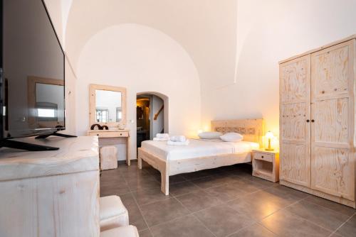 Villa Aegeon Grande tesisinde bir odada yatak veya yataklar