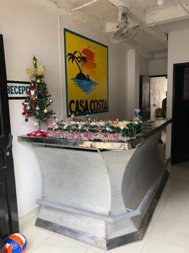 a counter with a christmas tree on top of it at Hotel Casa Costa in Capurganá