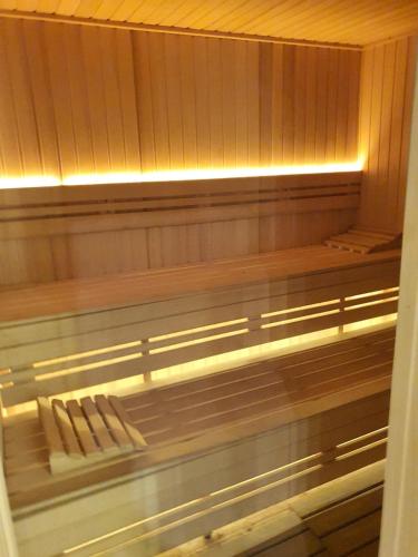 a sauna with two chairs sitting in it at Apartman Sladjana Premier 12 Milmari in Kopaonik