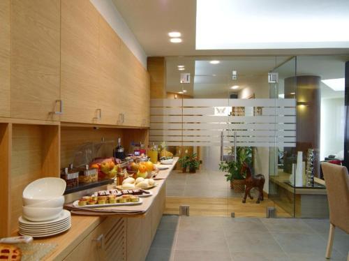 a kitchen with a long counter with food on it at Hotel Natura in Castel di Sangro