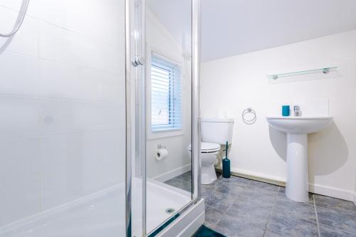 a bathroom with a shower and a toilet at Smart home near Chester City Centre in Chester