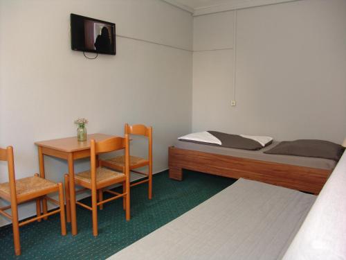 Giường trong phòng chung tại City Hotel Ansbach am KaDeWe