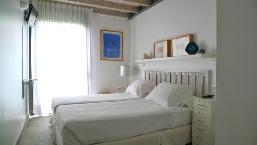 Postel nebo postele na pokoji v ubytování Las Villas de Cué