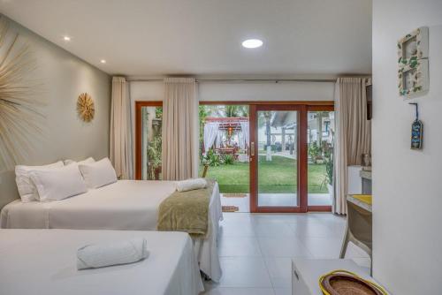 Postel nebo postele na pokoji v ubytování Pousada Ipioca Beach Village