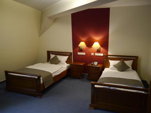 
Ein Bett oder Betten in einem Zimmer der Unterkunft Hotel Villa Keller
