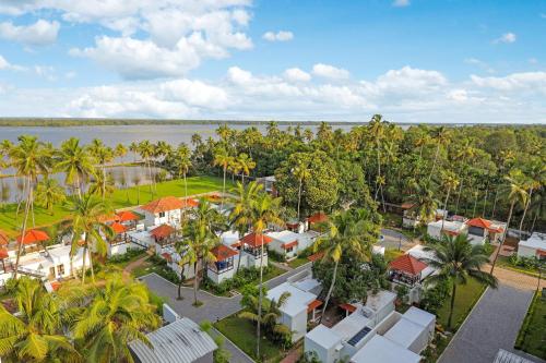 an aerial view of a resort with palm trees at Club Mahindra Arookutty, Alleppey in Alleppey