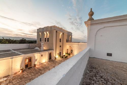 a view from the roof of a building with the sunset at Masseria Borgo San Marco in Fasano