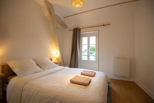 Un pat sau paturi într-o cameră la A la Motte Bridard