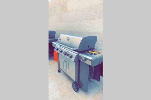 a blue and white barbecue grill in a room at Luxury fully furnished villa ڤيلا مؤثثة in AlUla
