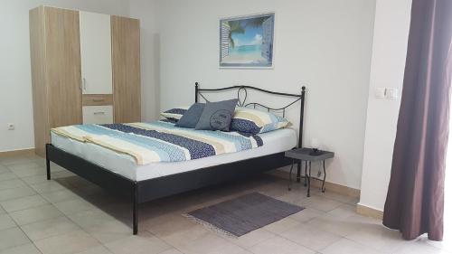 Postel nebo postele na pokoji v ubytování Hamo Apartments & Soba
