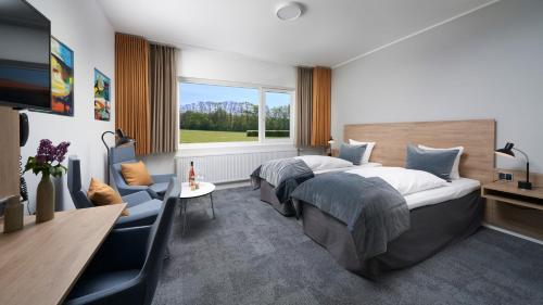 Ένα ή περισσότερα κρεβάτια σε δωμάτιο στο Trinity Hotel og Konference