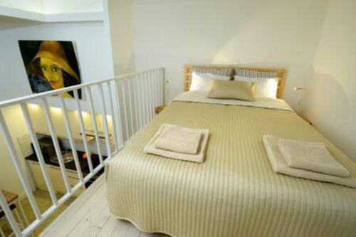 a bedroom with a large bed in a room at ORANGEHOMES two bedroom apartment Ráday str. in Budapest