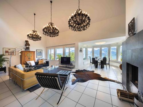 a large living room with a horse on the floor at Villa Ysara, Pool Villa with lake Lucerne View in Lucerne