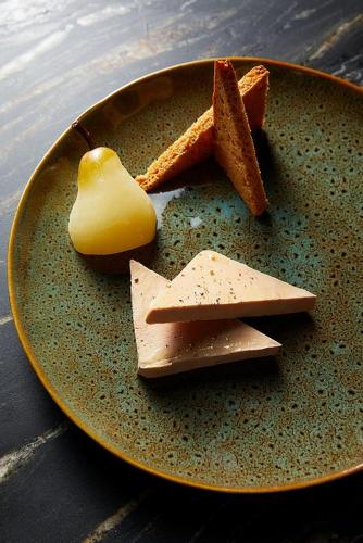 a plate with cheese and bread and a piece of butter at Hôtel Restaurant Vaillant proche Europapark Rulantica in Sélestat