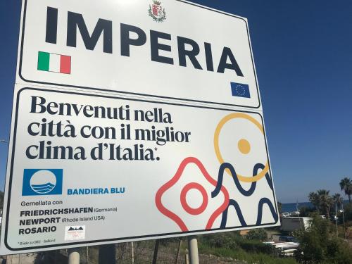 a sign that reads imperia in a foreign language at Casa Ginni con Piscina e giardino in Caravonica