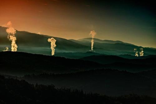 a group of smoke coming out of a mountain at Piccolo Borgo Toscano relax in Monteverdi Marittimo