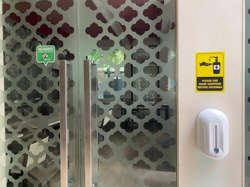 a glass door with a bunch of stickers on it at The Atara Near Golf Course Road in Gurgaon