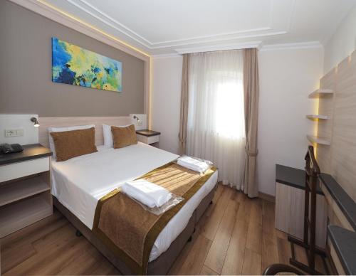 Hotel Bulvar Palasにあるベッド