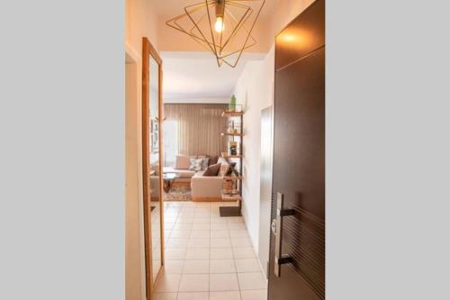 a hallway leading into a living room with a living room at Sweet Home #Center# in Volos