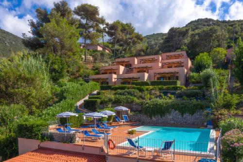 a resort with a swimming pool and a resort at Vistamare La Fonte in Nisporto