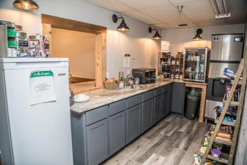 a kitchen with a counter and a refrigerator at Mountain Inn at Lutsen in Lutsen